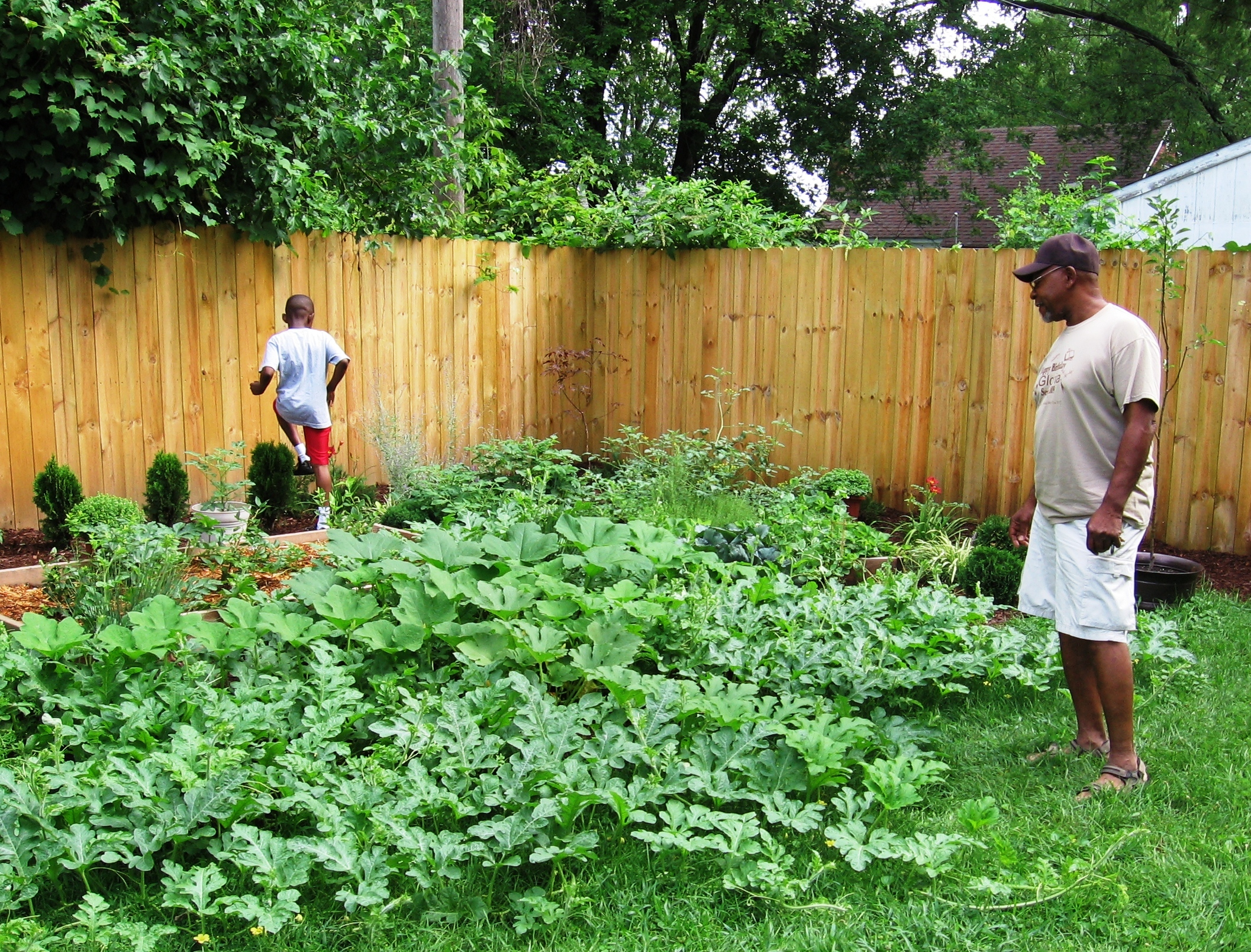 Chris showing his grandfather Artie Short the garden he grew