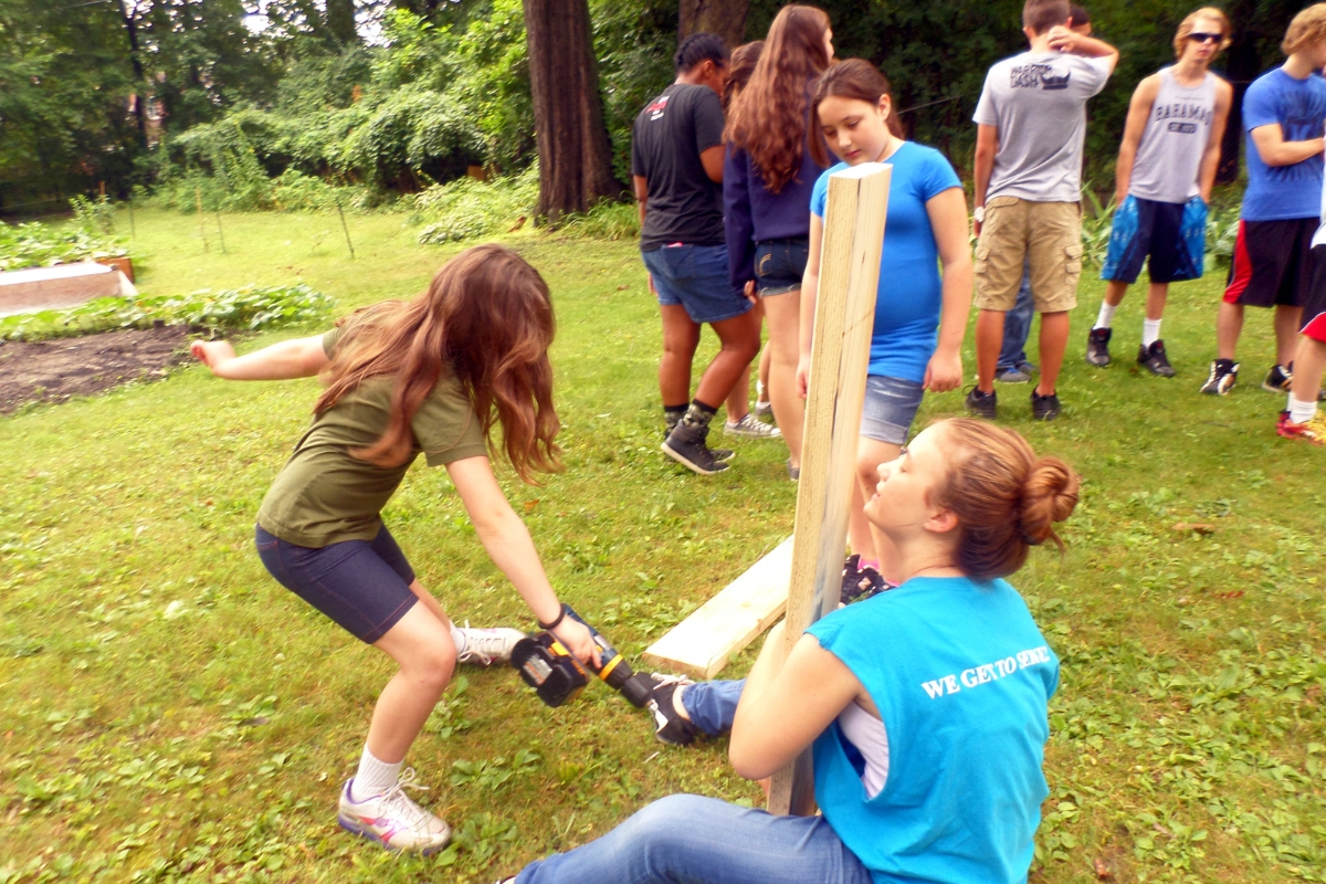Youth day — young people building raised beds and growing food together